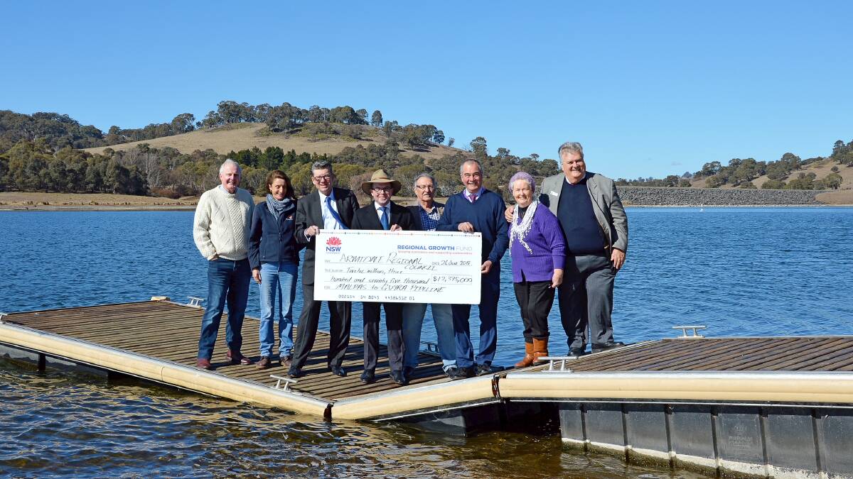 State MP hands over the big cheque locking in Malpas Dam pipeline