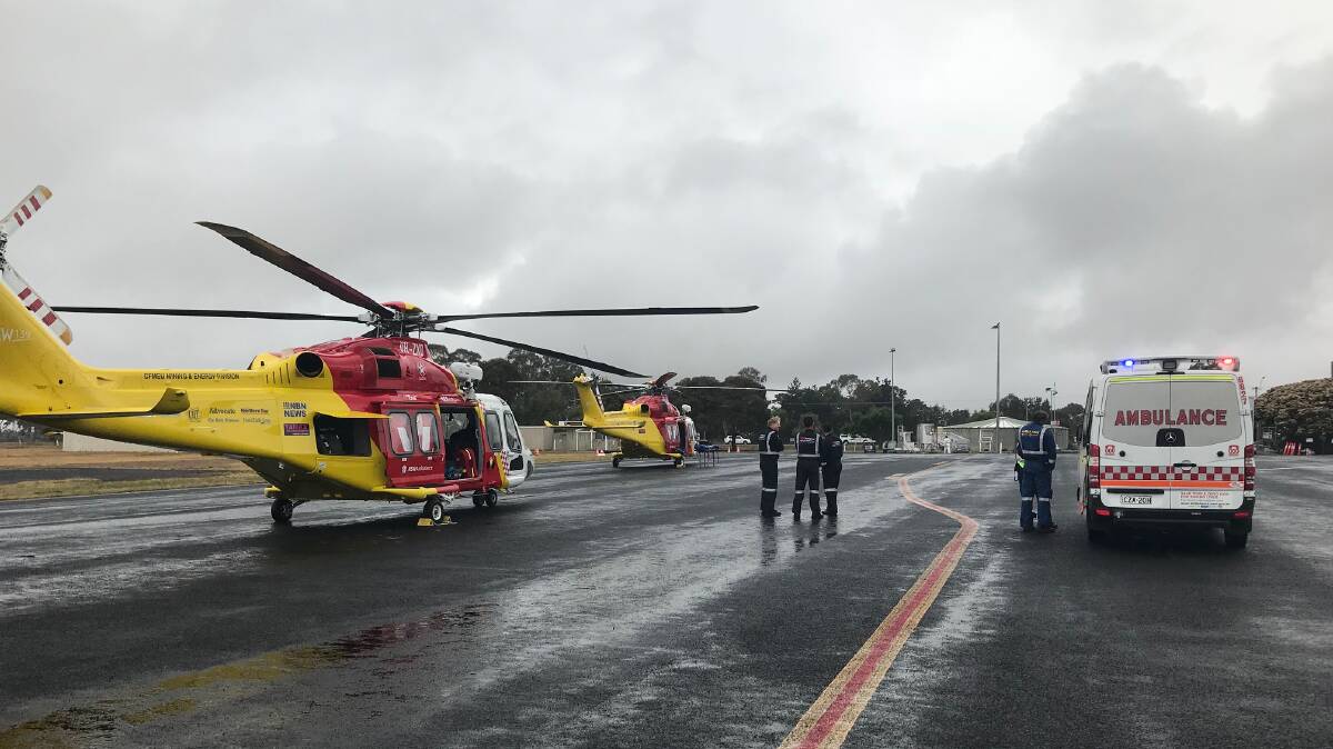 Double mission: The Westpac Rescue Helicopters from Tamworth and Newcastle collected the patients at Armidale Airport. Photo: Westpac Rescue Helicopter Service