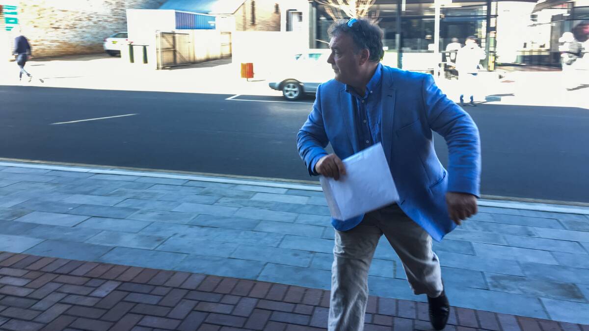 Legal challenge: Rod Culleton tries to avoid Fairfax Media outside Armidale Local Court in early-August. Photo: Matt Bedford