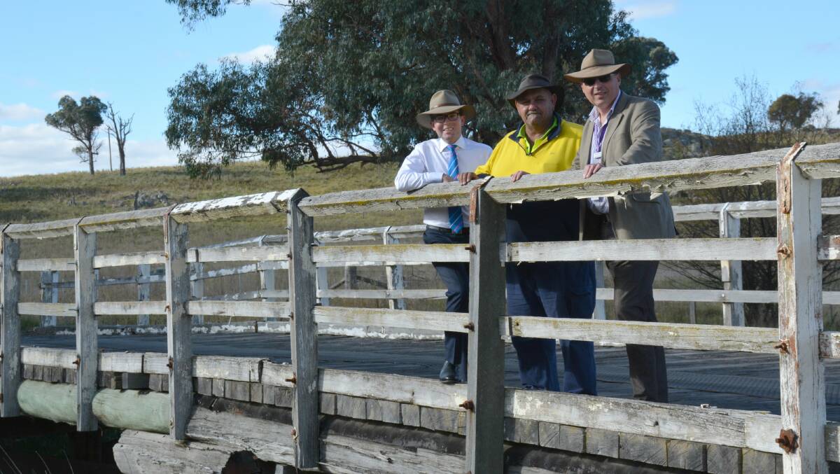 RELIC: Northern Tablelands MP Adam Marshall with Armidale Regional Council’s John McLeod and Mark Piorkowski on Laura Creek Bridge near Guyra, one of the ageing timber bridges slated for replacement.