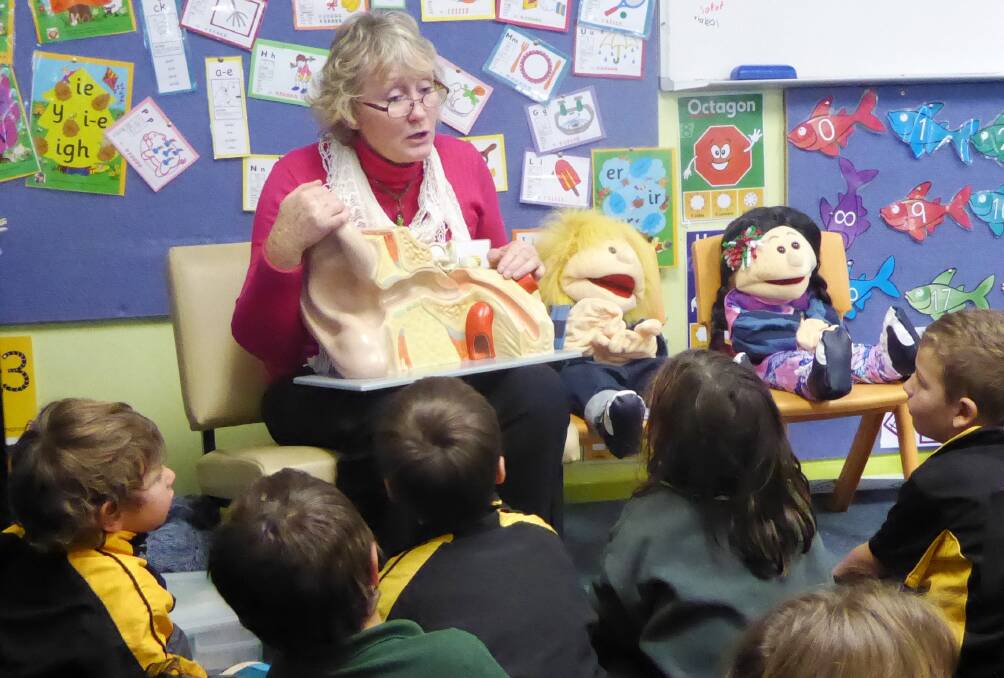 LISTEN UP: Students at Black Mountain Public School learn about the ear with Mrs Bev Wall, from the Department of Health and Ageing, as part of the Healthy Hearing Program.