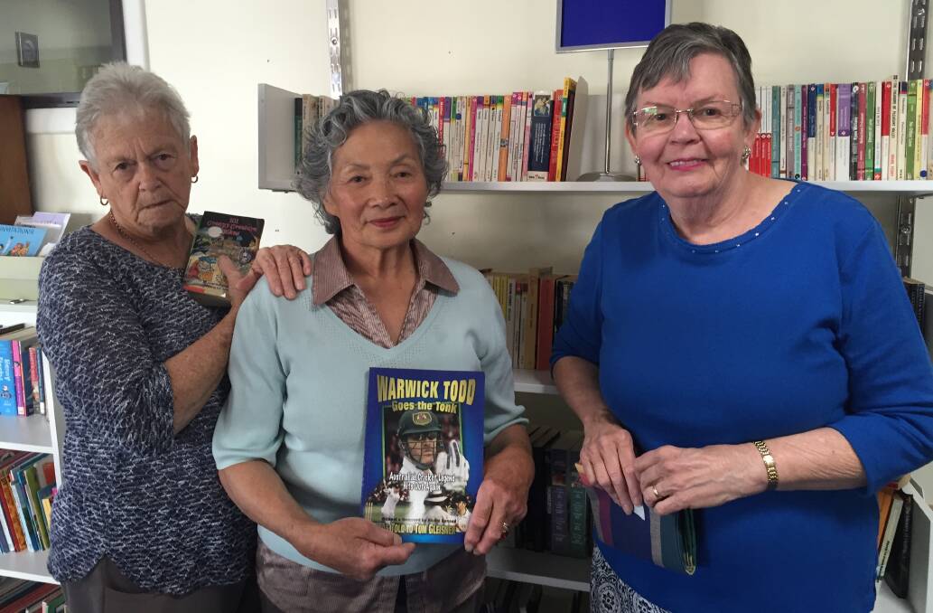 Big deal: Volunteers Shirley Reeves, Audrey Holloway and Margaret Day stocking shelves while preparing for the big sale.