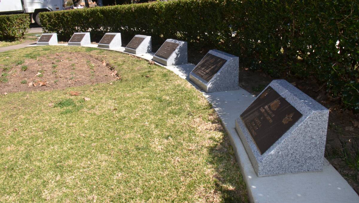 Seven new memorial plaques near the World War I cenotaph in Armidale’s Central Park.