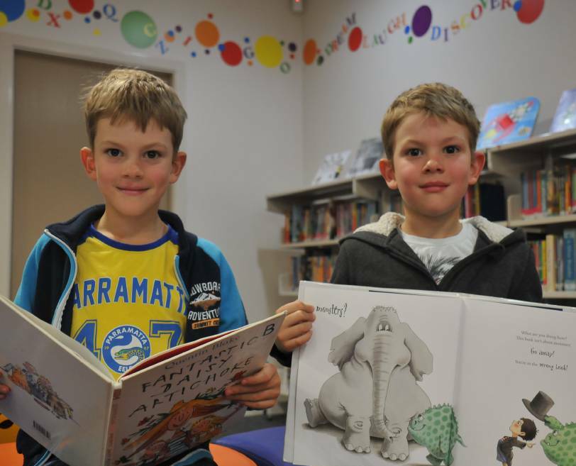HOLIDAY ACTION: Liam and Will Hutton enjoying holiday activities at the library earlier this year. Photo: Madeline Link.