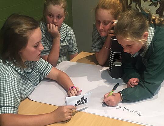 Cracking the code: Guyra students engage in coding class at the Guyra Library. 