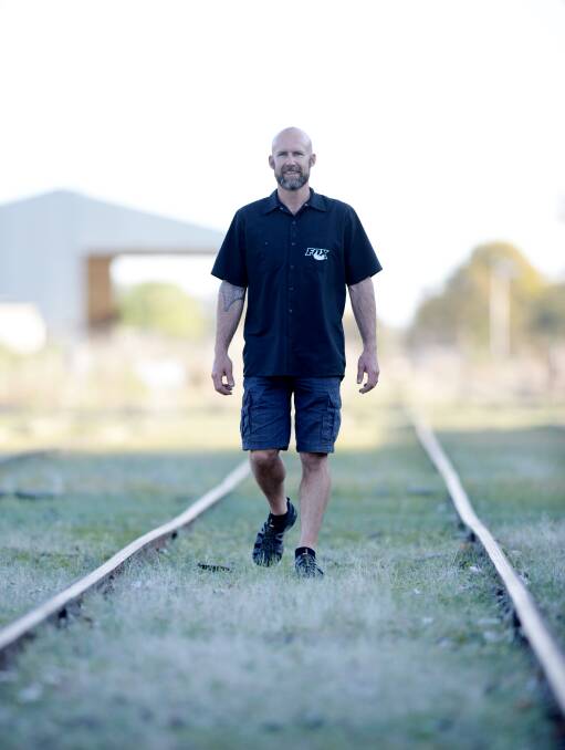 On track: David Mills walking along the old railway line in 2013.