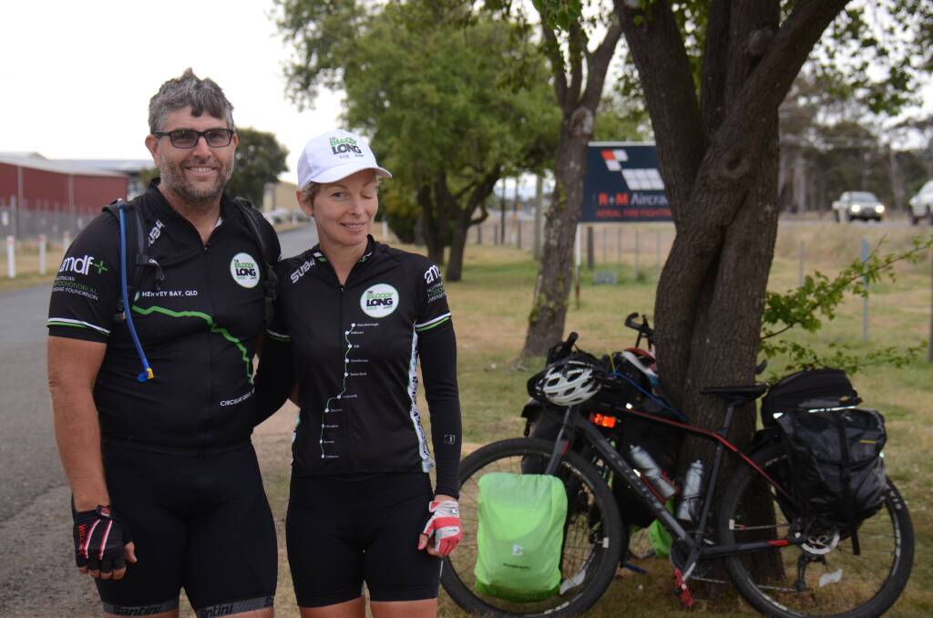 BIG TREK: Mel Behrens-Macaulay and Andrew Macaulay near the Armidale Regional Airport on Monday afternoon. The pair enjoyed a quick break before hitting the road to Uralla where they stayed Monday night.