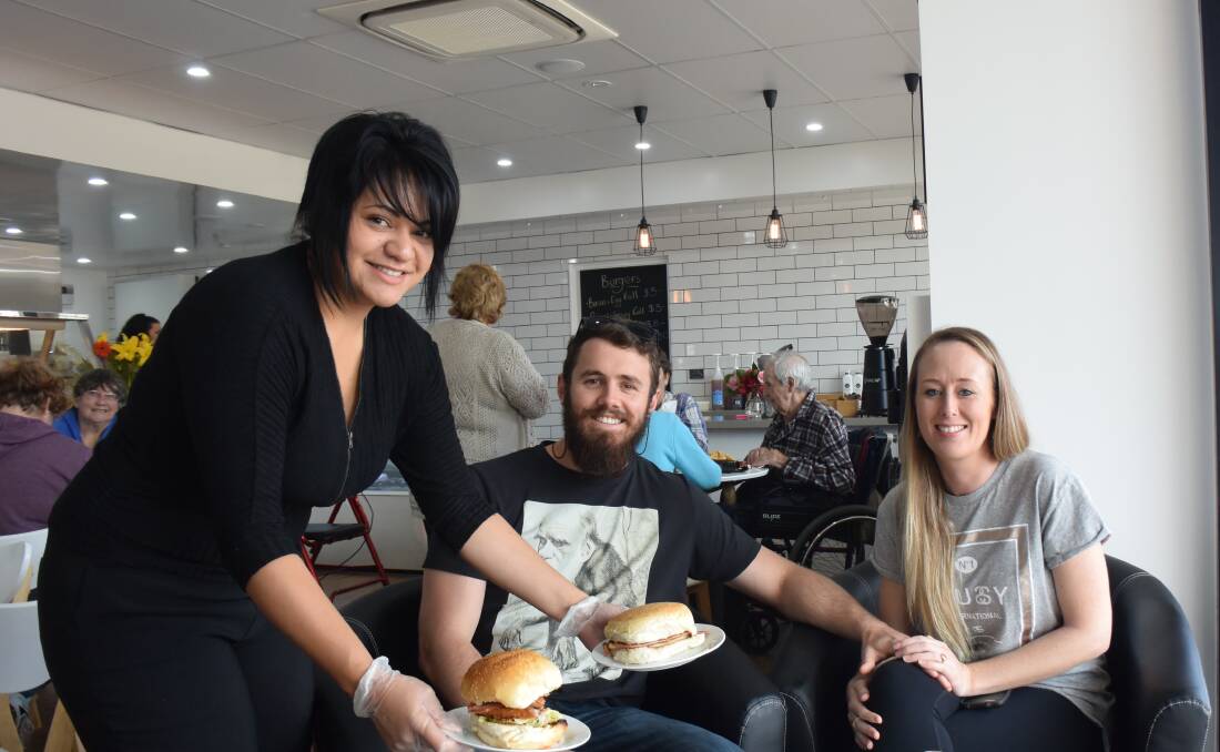 The Guyra Cafe's chef Amanda Bishop serves up a mouth-watering meal to locals Brett Nielsen and Celia Quinn who are trying out the new go-to for the first time.