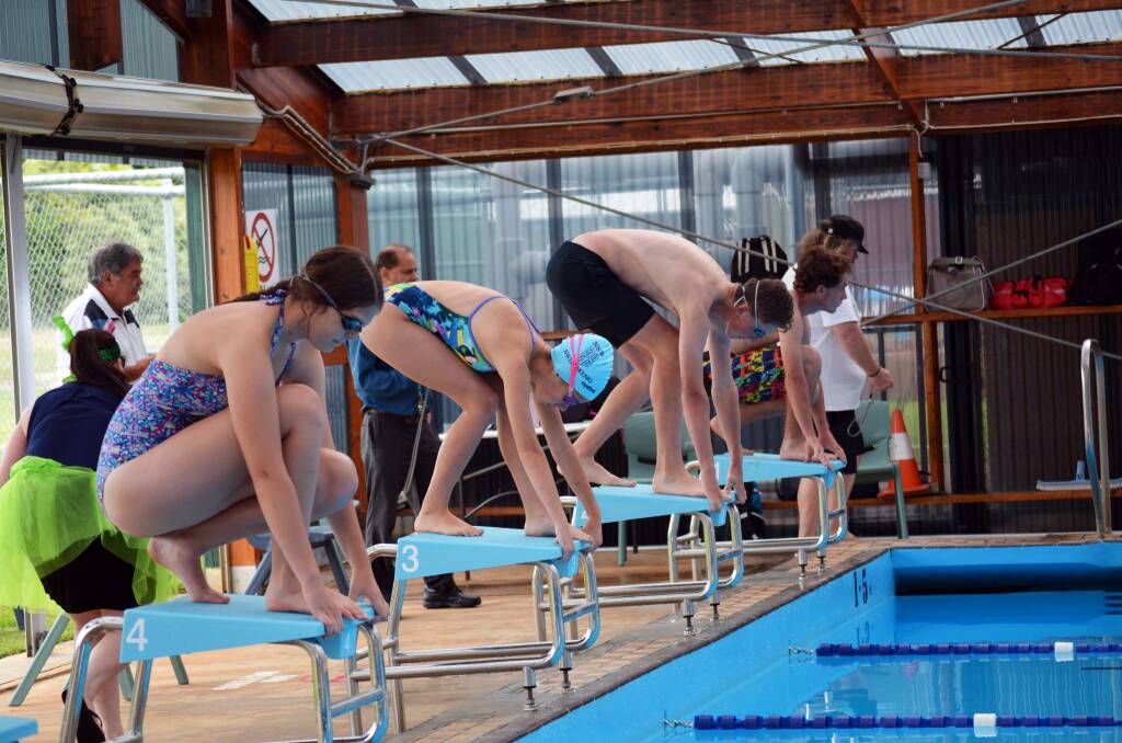 MAKE A SPLASH: Hannah Gordon, Bronte Stanley, BJ Cameron and Charles Irwin on the blocks at last week's secondary swimming carnival.