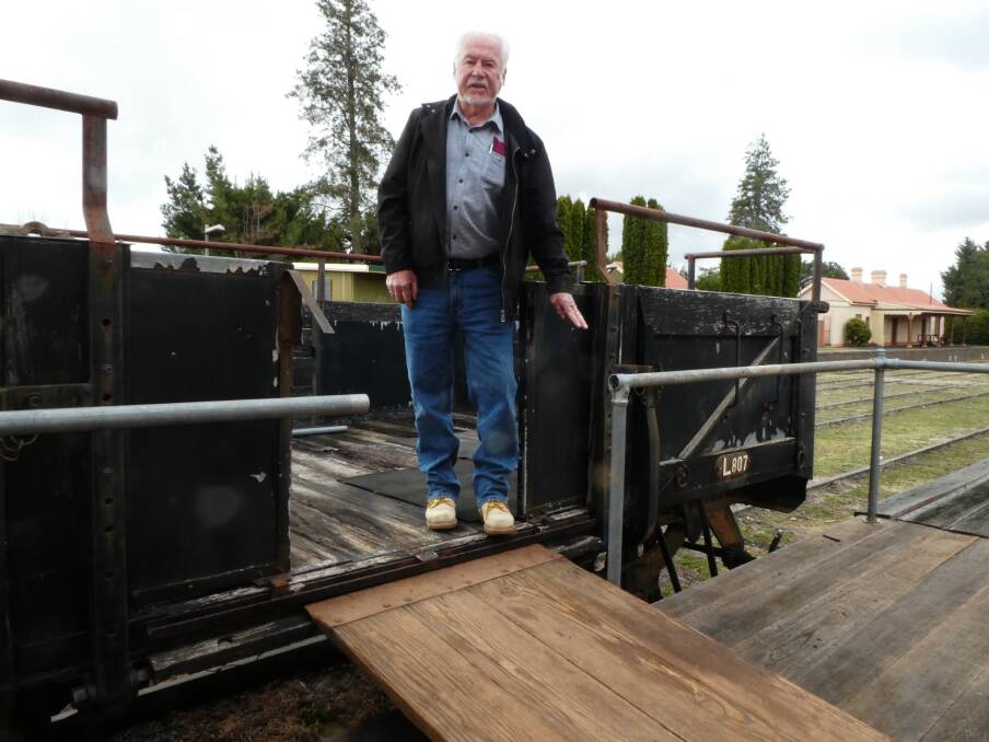 HERITAGE: Antique Machinery Club member Peter Hanson with the railway carriage being renovated for the festival. Photo: Lynne Chapman