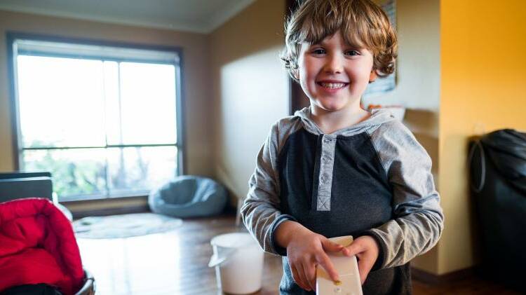 Boy with remote control. Photo: Katherine Wilson Photography / NSW govrenment.