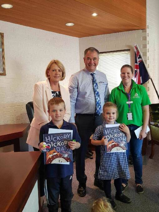 SHARING A STORY: Former Guyra Central School principal Jo Burgess, Armidale Regional Council mayor Simon Murray, and event organiser Aimee Hutton \with young friends Parker Campbell and Callie Cameron. Photo: Guyra Library