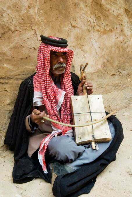 A Bedouin plays his stringed instrument in  Jordan. Photo: Robert Harding Picture Library 