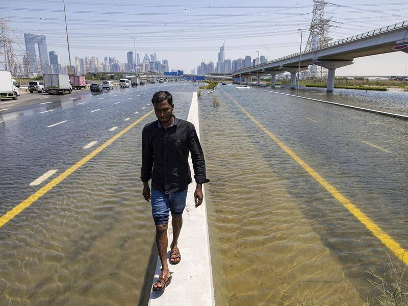The United Arab Emirates is cleaning up after being hit by its heaviest recorded rainfall. (AP PHOTO)