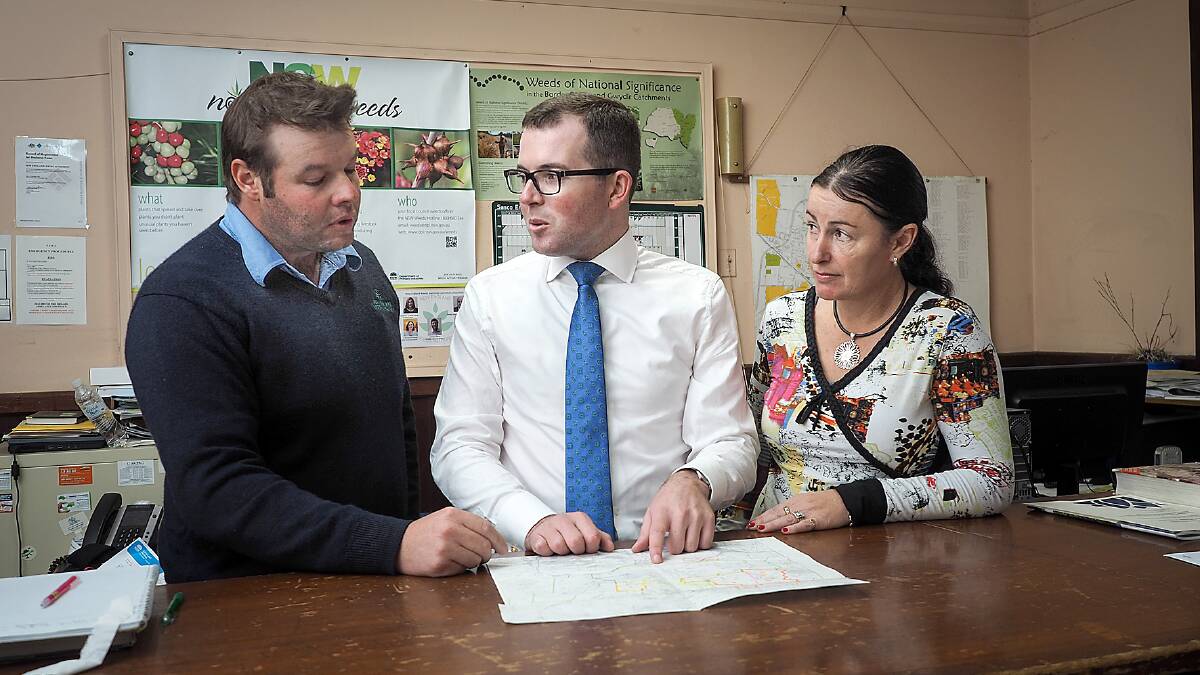 New England Weeds Authority District Weeds Officer Josh Biddle, left, 
Northern Tablelands MP Adam Marshall and New England Weeds Authority 
chair Maria Woods discuss the funding announcement