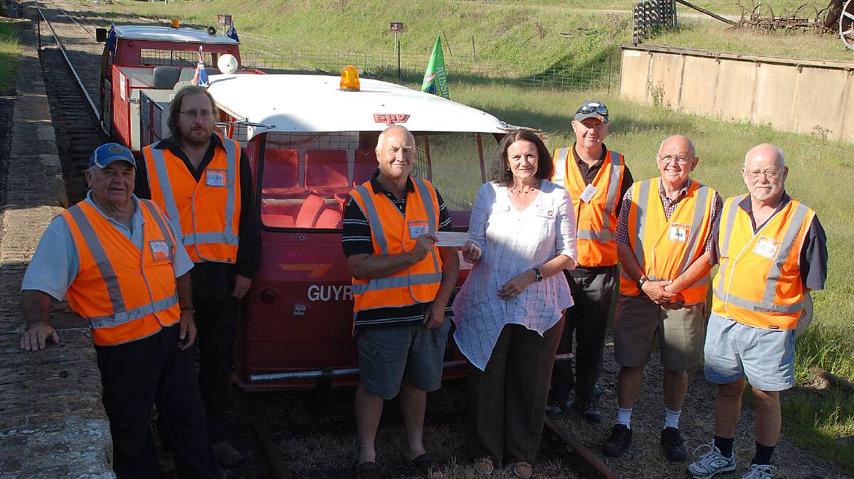 Members of Guyra & District Historical Society Machinery Group Inc. 
handover their donation for the construction of a helipad at Guyra MPS
Ron Lockyer, Ashley Harper, Wayne MacKenzie, Wendy Mulligan, Paul Dullaway, Bob Vidler and Doug Kay (absent Maureen Lockyer)