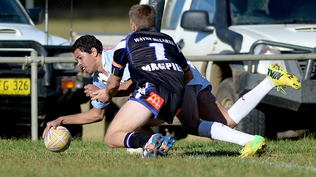layers’ player, Kyle Mongta evades the Magpies to go in for his third try of the match