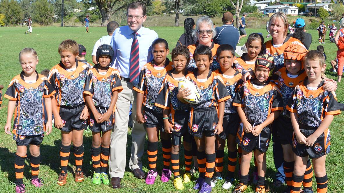 Member for Northern Tablelands Adam Marshall pictured  with some Tingha Tigers’ junior players and minor league coordinators Robyn Dixon, left, and Sharon Gates.