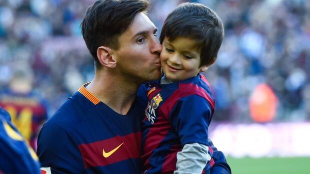 Lionel Messi kisses his son Thiago before the game. Photo: Getty Images