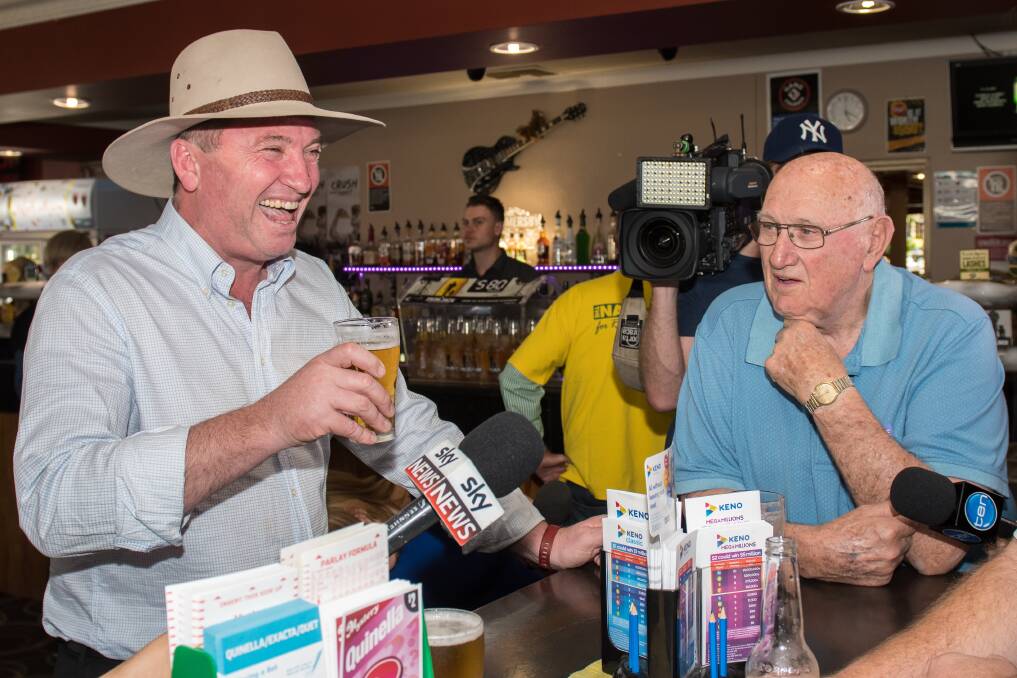 TIME FOR A BEER: Barnaby Joyce shares a laugh with a local at the Longyard Hotel. Photo: Peter Hardin 
