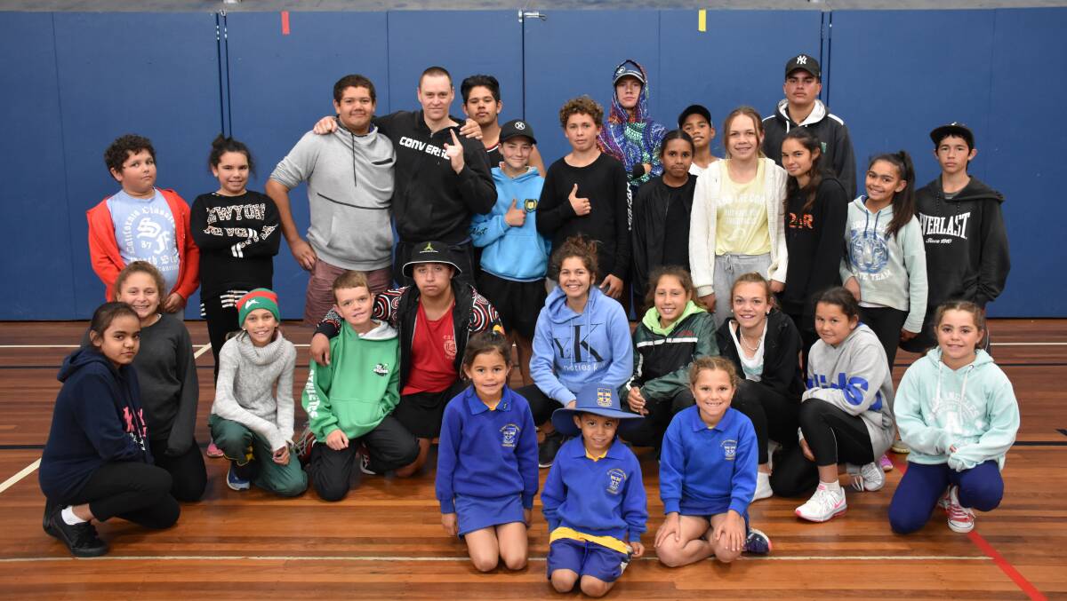 Fighting chance: New England Detective Sergeant Matt Crotty, pictured back fourth from left, with kids at Armidale's Nanyapura boxing program this week.