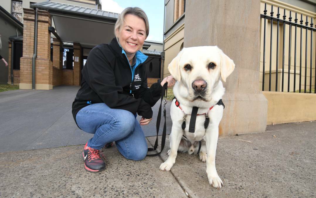 Canine Court Companion volunteer Katy Dunlop and Marshall. Photo: Jude Keogh