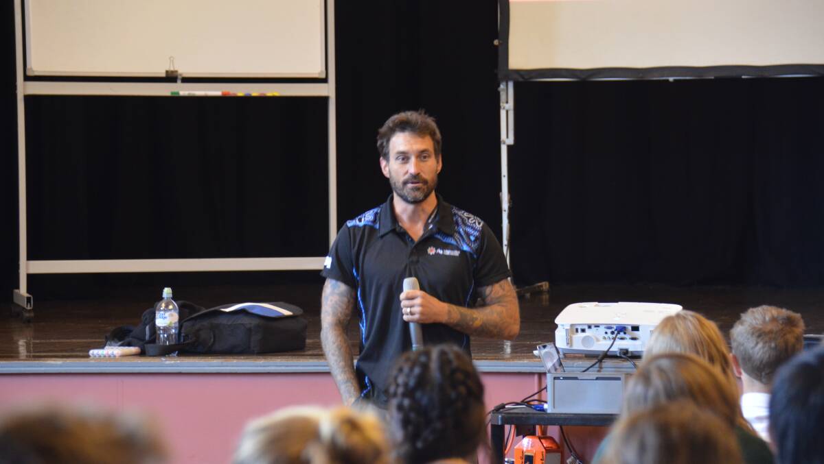 SPEAK UP: Psychologist Clinton Schultz speaks to students from Guyra and Armidale at the LIVINWELL workshop at Armidale's Town Hall on Wednesday.