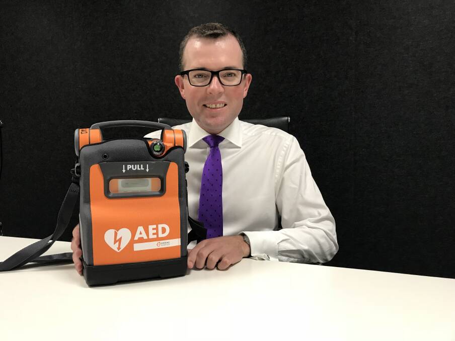 LIFE SAVING: Northern Tablelands MP Adam Marshall with an Automated External Defibrillator (AED), something he hopes will be a regular site at local sporting clubs across the region soon.