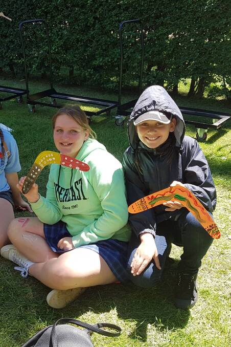 CULTURAL EXPERIENCE: Guyra Central School pupils Tiana Kirk and Sativa Collins enjoying the boomerang painting lessons.
