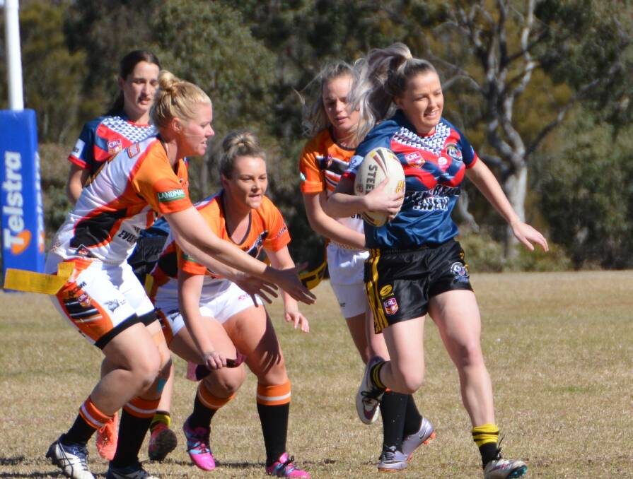 CLOSE ONE: Uralla's Camilla Clydsdale and Hannah Skewes defend Tenterfield's Shay Landers in their round 14 clash on Sunday. Photo: Melinda Campbell. 