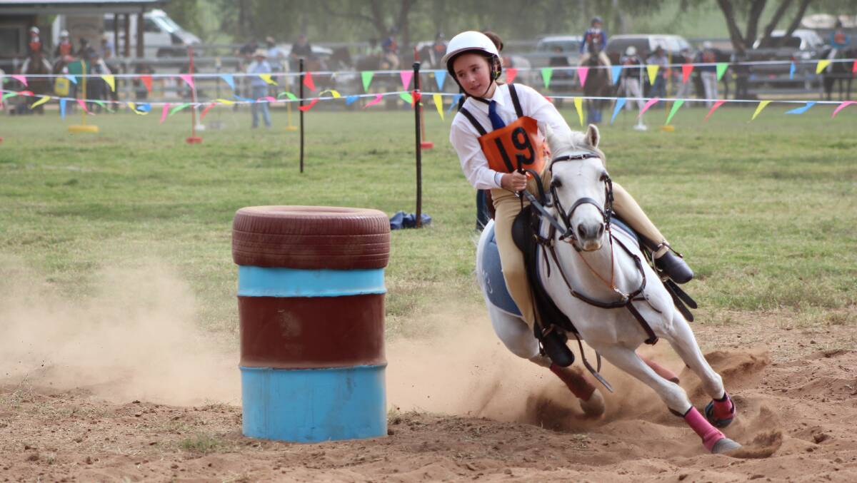 BLITZING THE COMPETITION: Mackenzie Ellem finished eighth in the under 11 barrel race at  the Pony club NSW state sporting championships. Photos: Stuart and Tish Ellem