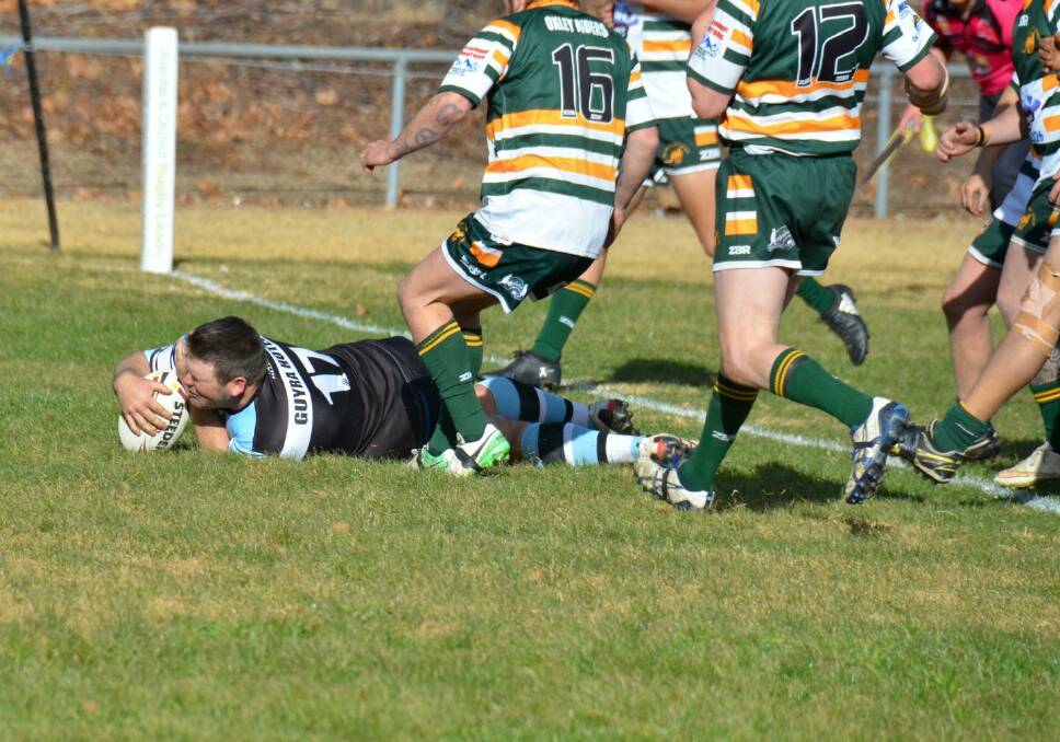NAILBITER: Super Spuds captain Dan Vidler crosses for the first of his two tries against Walcha on Sunday. 