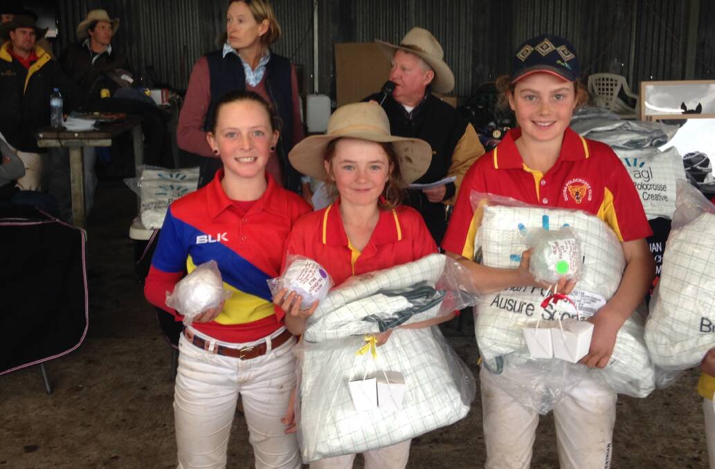 CLEANING UP: Bunnan's Emily Walmsley with Guyra's Brooke Grills and Bridget McKemey at the carnival. 