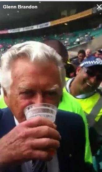  A screengrab from a YouTube video showing the former PM Bob Hawke skolling the from Mr Brandon.