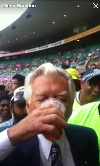  A screengrab from a YouTube video showing the former PM Bob Hawke skolling a beer from Mr Brandon. 