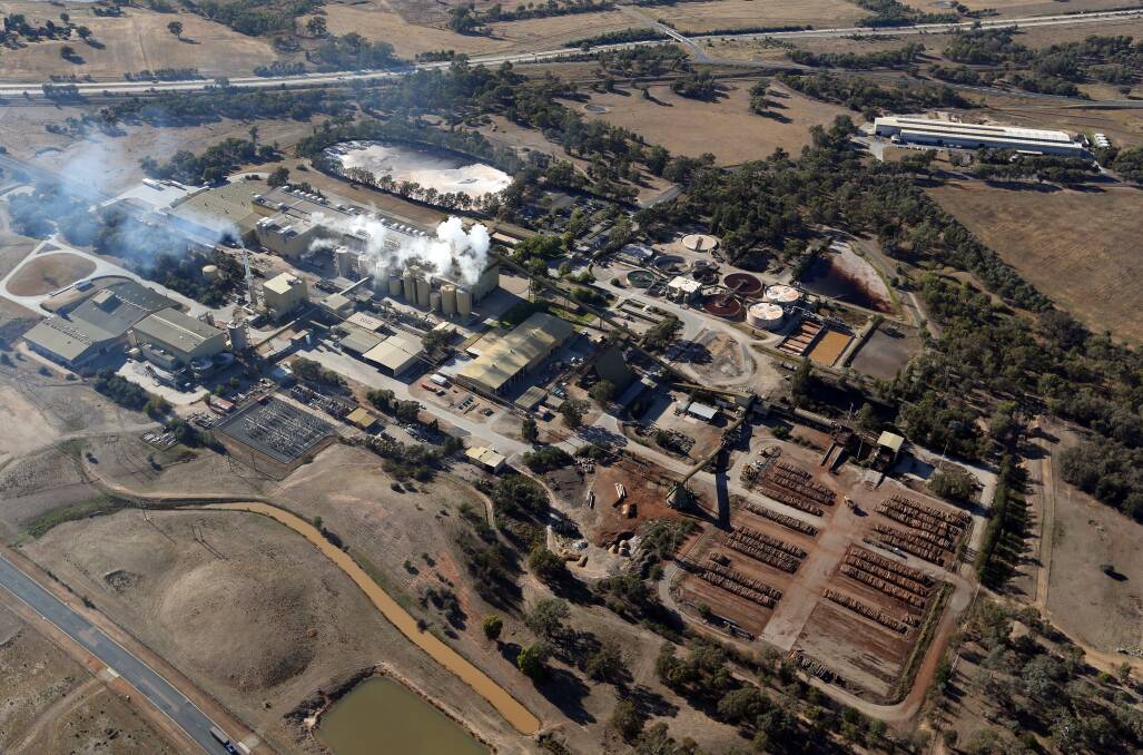 Overall view: The Norske Skog paper mill from above looking to the east and the old Hume Highway in the top of the shot. Last week's tragedy happened at the building with white vapour clouds over it.