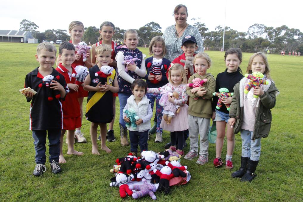  Western Districts Cricket Club secretary Shauna Hammat handed out some of the teddies at junior sport at Parndana on Satuday. Photo supplied 