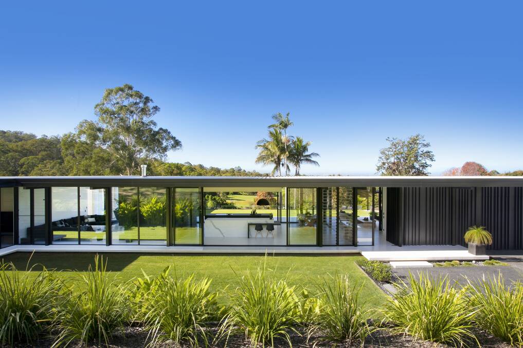 INSPIRED: The Doonan Glasshouse boasts minimalist details, a pared back palette and a lush, tropical backdrop surrounding this modern family home. 