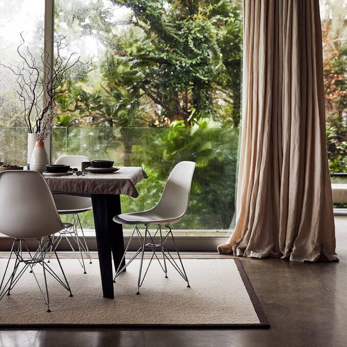 IN THE ZONE: Rugs have the ability to define a dining space and help make visual sense of larger spaces. 