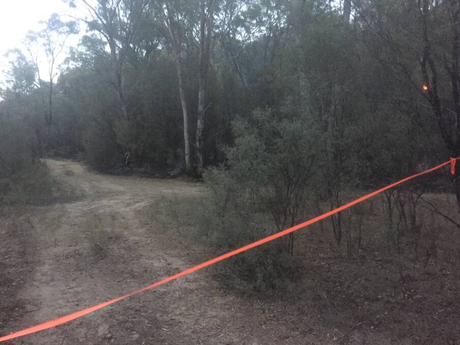 The Rural Fire Service's containment line began at the back of a local resident's property.