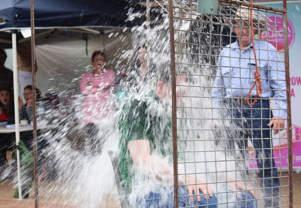 DUNKED FOR A CAUSE: Northern Tablelands MP Adam Marshall gets dunked despite the rain at the Guyra Christmas Party to raise funds for the preschool.