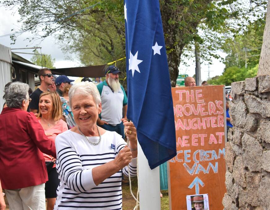 CITIZEN OF THE YEAR: Sue Adams raises the flag at the Guyra Australia Day ceremony.
