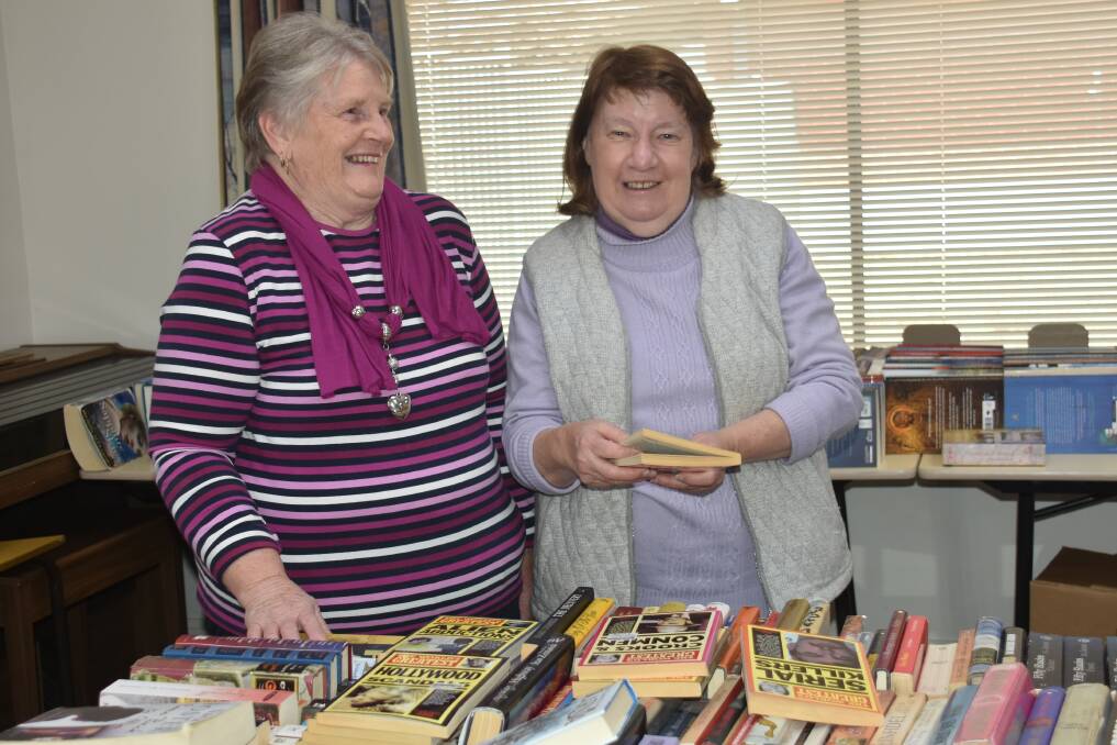 BOOKS FOR SALE: Wilma Reeves and Gail Montague will man the Guyra Hospital Auxiliary Book Fair this week. Photo: Nicholas Fuller