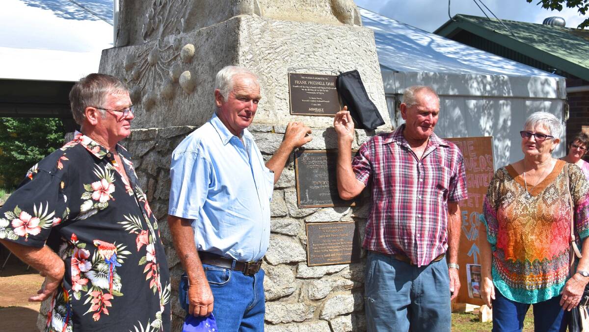 The Presnell family - Owen, John, Barry, and Frances - unveil the plaque in honour of their late father, Frank.