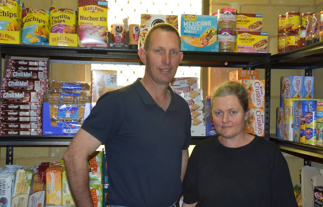 PASTORAL CARE: Tony and Ruth Stace, of Northwest Church, organise the Food Pantry each Friday. Photo: Nicholas Fuller