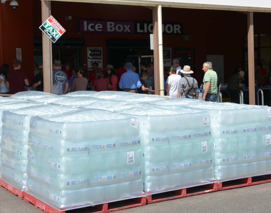 Coles donating 10 litre water containers to Tenterfield last month. Picture by Melinda Campbell.