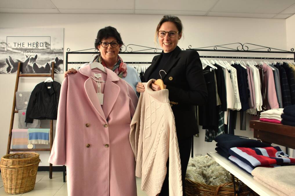 WINTER WARMTH: Liz Foster and Jess Webb with some of the wool garments for sale at their Fleece2Fashion shop. Photo: Nicholas Fuller