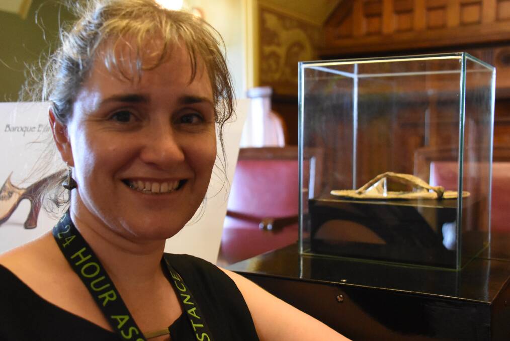 THONGS FOR THE MEMORY: UNE Museum of Antiquities curator Dr Bronwyn Hopwood with the latest acquisition: the oldest thong in Australia. Photo: Nicholas Fuller.