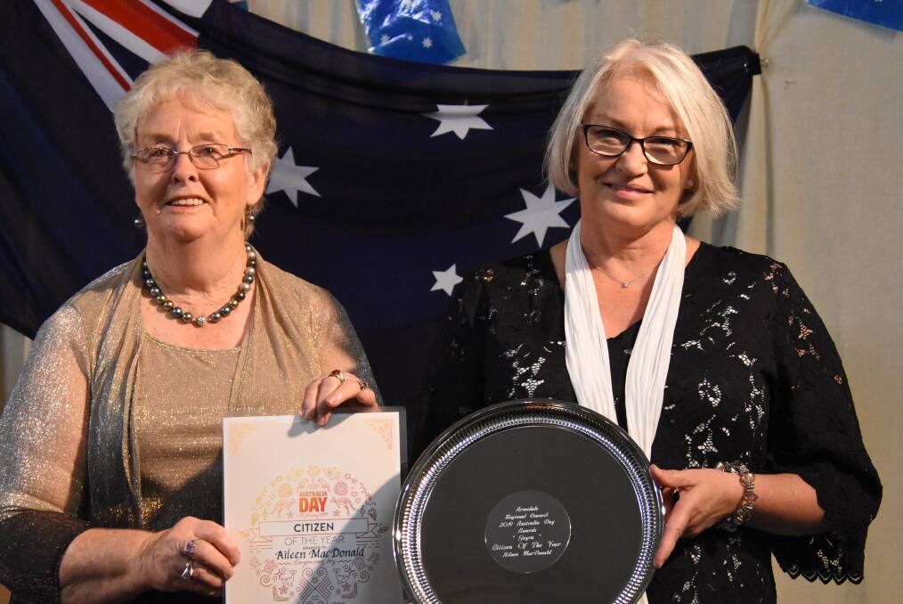 PASSING ON THE BATON: Dot Vickery, 2018 Guyra Citizen of the Year, presents the award to the new Citizen of the Year, Aileen MacDonald. Photo: Nicholas Fuller