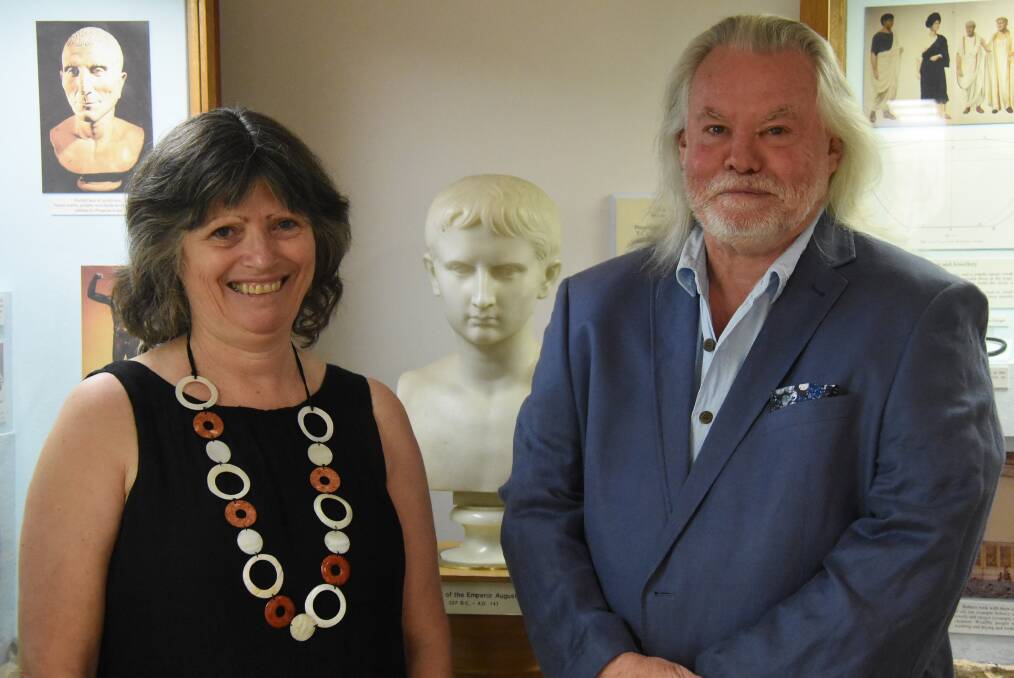 PERSONALITY: Historians Dr Lea Beness and Professor Tom Hillard, with the ominous figure of Augustus, Rome's first emperor. Photo: Nicholas Fuller